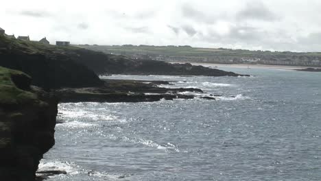 waves breaking against the coastline
