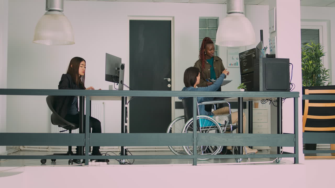 Multiethnic group of programmers collaborating on it project to create algorithm