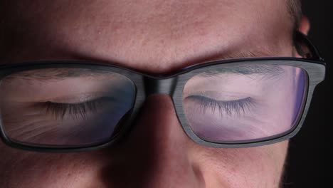 digital screen flashes on a nerd with spectacles, closeup