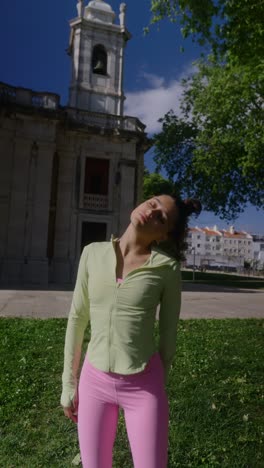 woman stretching in park