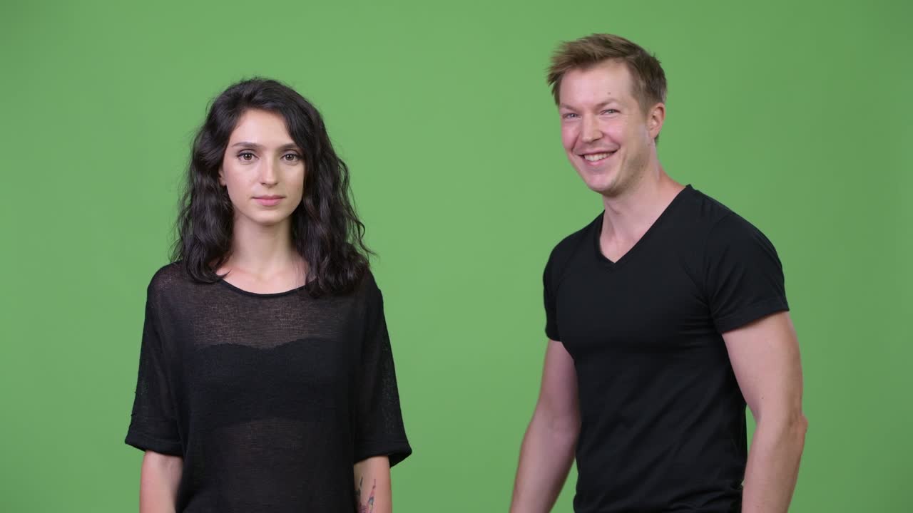 Young couple with arms crossed together