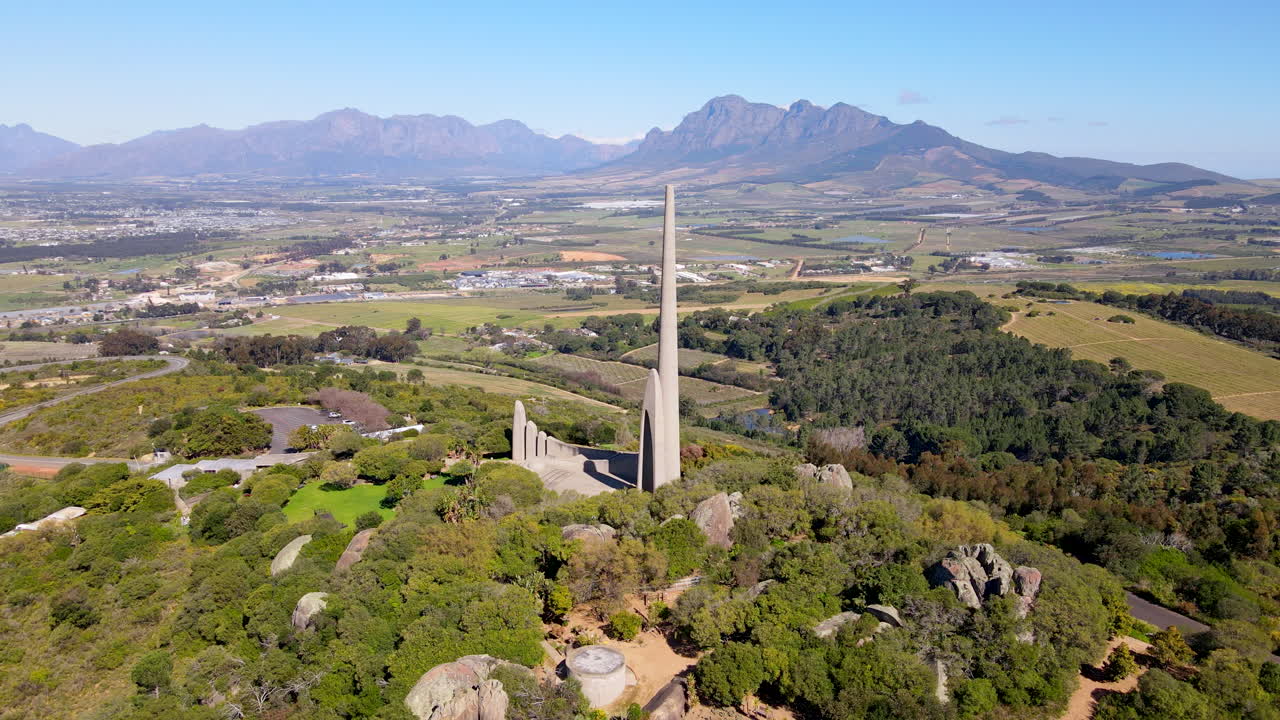 Proud Afrikaanse Taalmonument perched atop Paarl mountain, rotating aerial