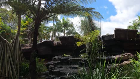 lush greenery surrounding a cascading waterfall