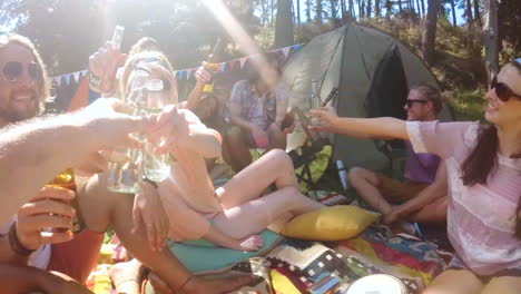 group of friends toasting beer bottles