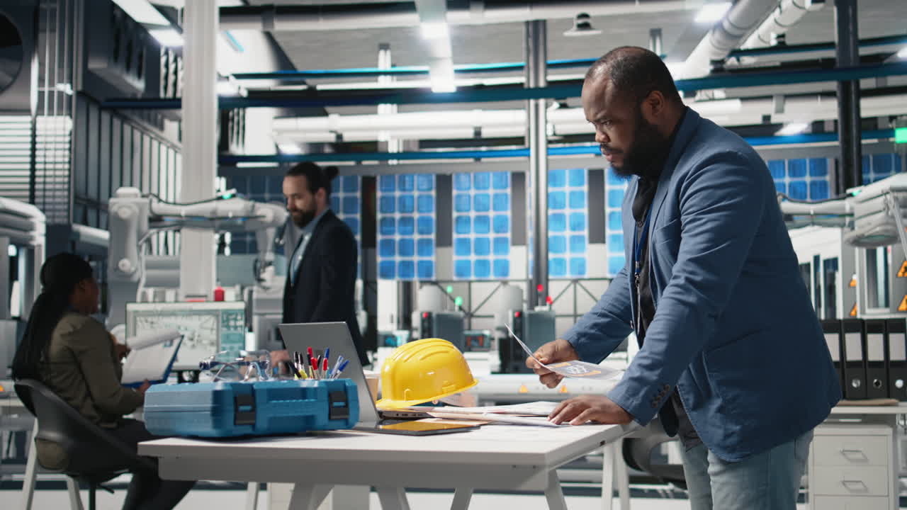 Engineers collaborating in a manufacturing plant
