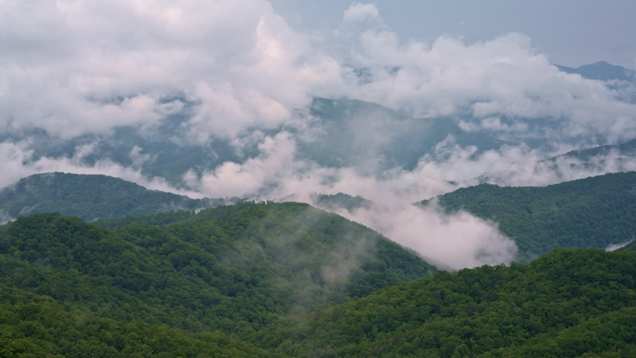 Cloudbanks crashing into the misty hollows of the Great Smokies — cinematic drone