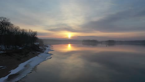 winter sunrise over a frozen river