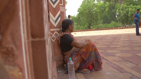 reveal shot of elderly indian woman sitting