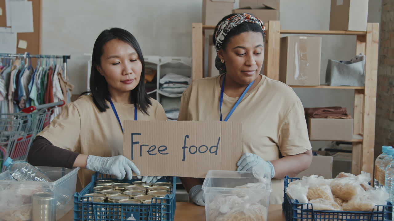 Portrait of Volunteer Workers with Food for Needy People