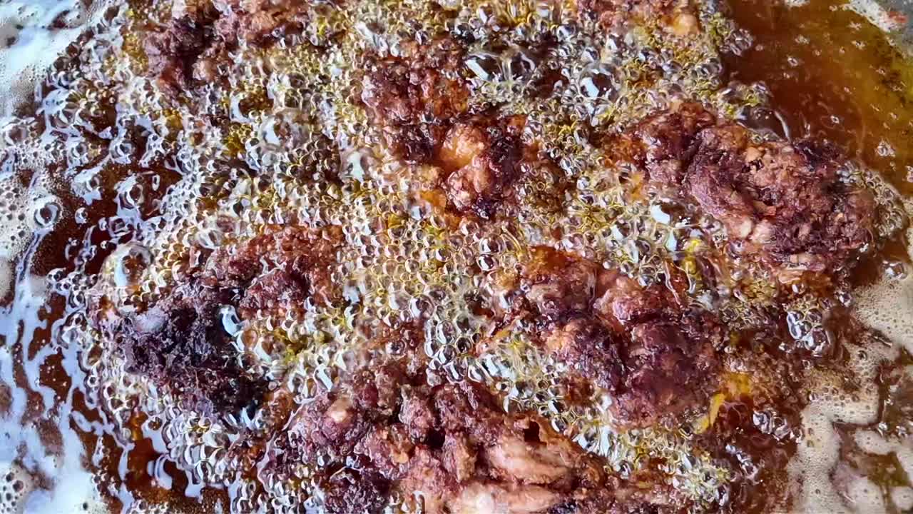 Fried food being cooked in oil