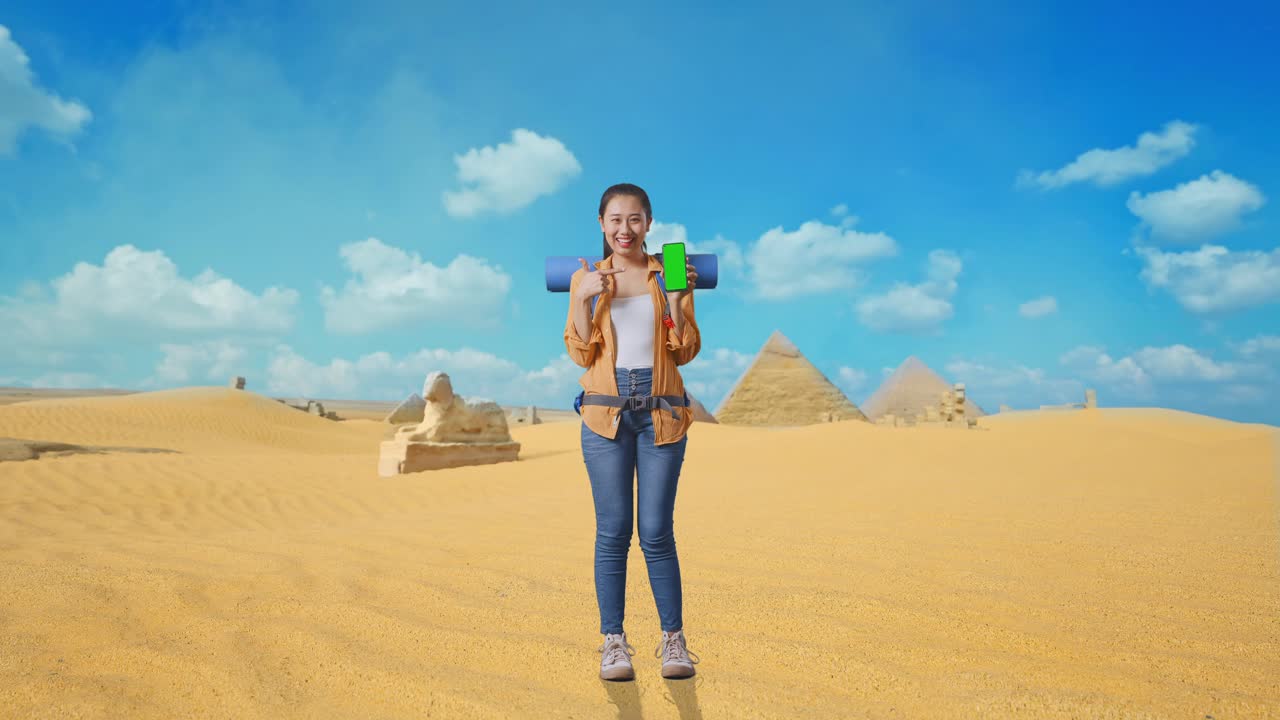 Woman Traveler with Green Screen Phone in Egypt's Desert