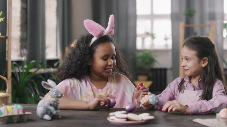 Happy Girls with Easter Eggs Smiling for Camera