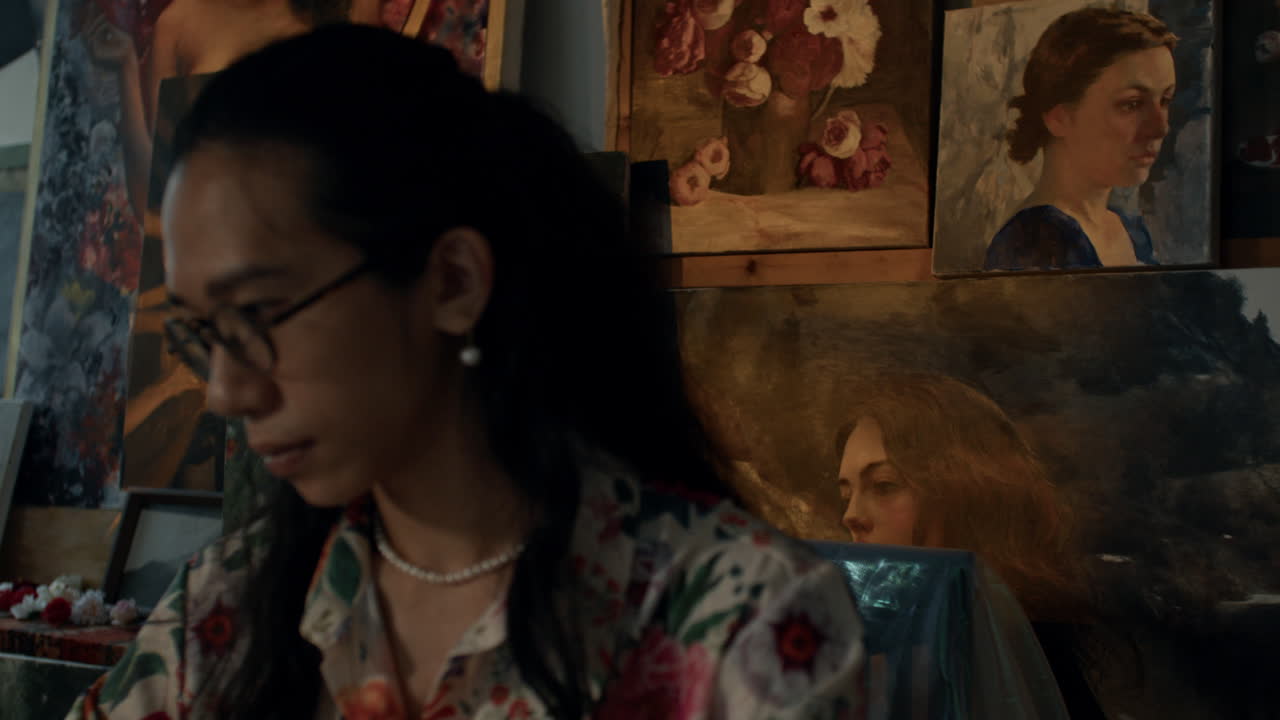 Artist painting in studio filled with creativity and focus