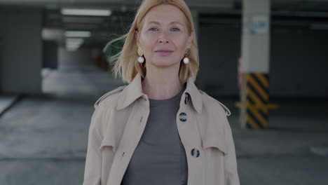 smiling woman giving an ok sign in a parking garage