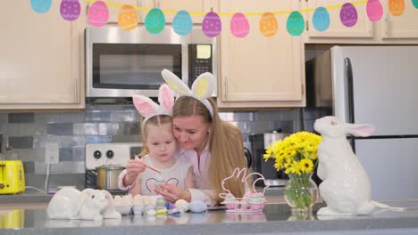 woman decorating colorfull easter egg