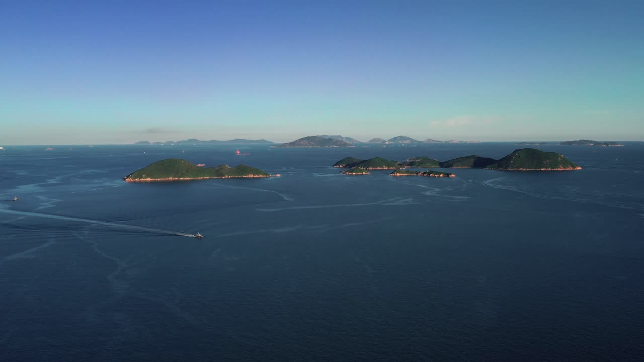 Aerial view of Peng Chau, Lantau Island, Drone Aerial View, Hong Kong, China, Asia. Aerial view of beach and sea with white ship sailing in Peng Chau on Lantau Island in Hong Kong