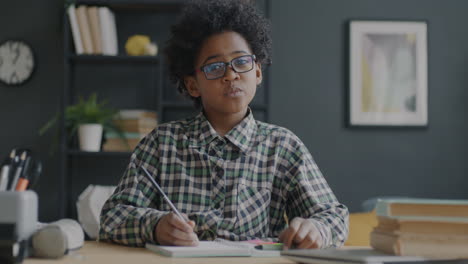 child studying at a desk