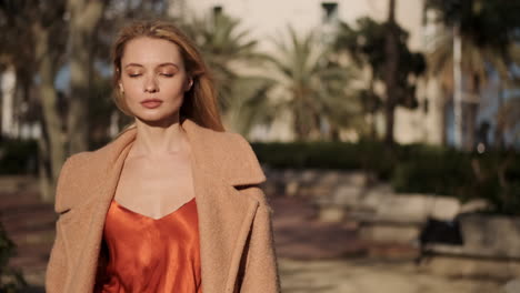 young woman walking outdoors.