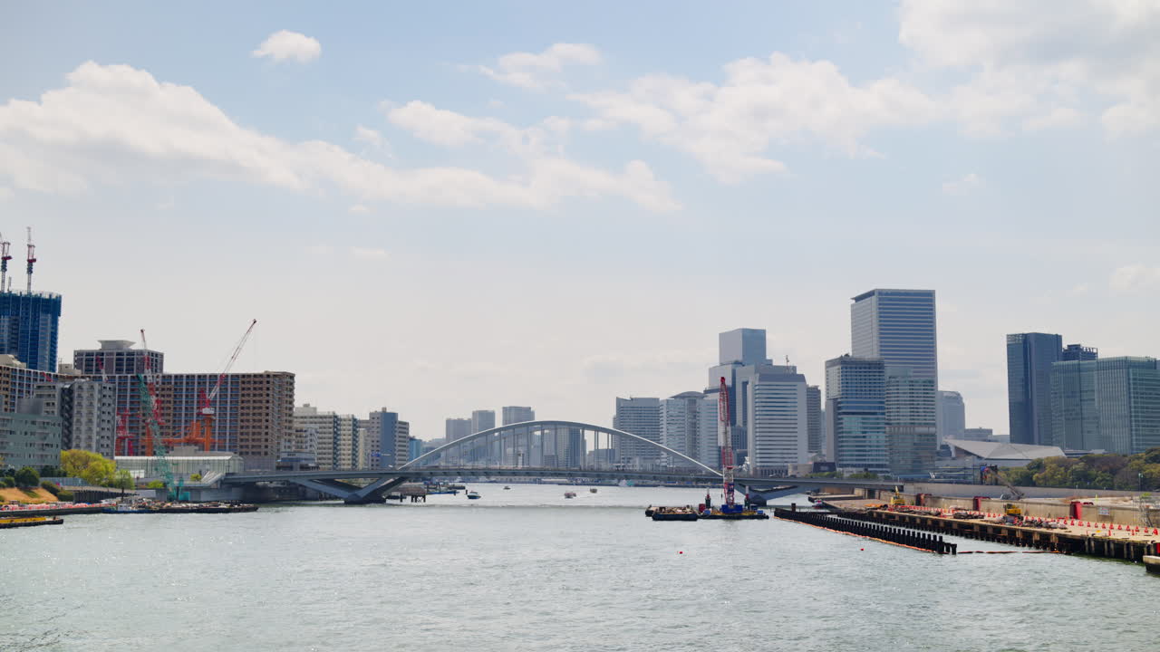 View of the Kachidoki Bridge with the buildings in Chuo, Japan on the background in daylight
