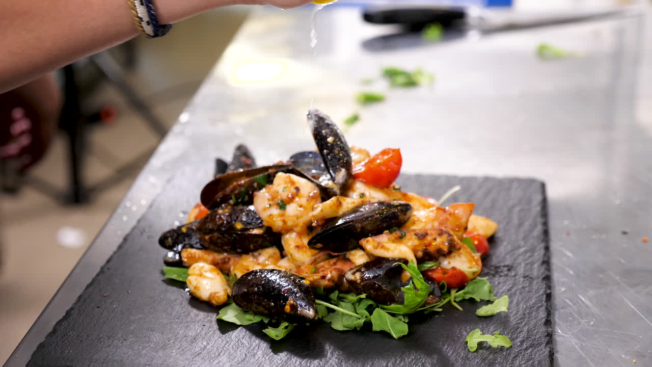 Seafood salad with mussels, squid and tomatoes