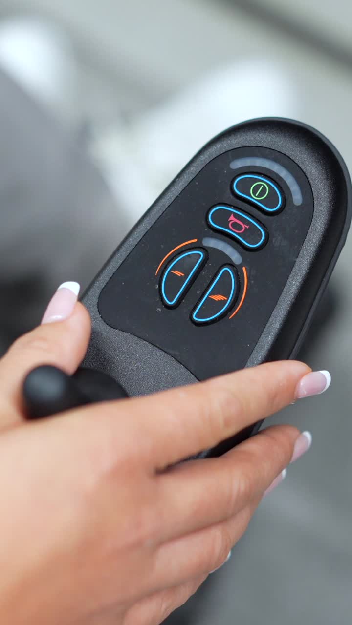 Remote control held in hand