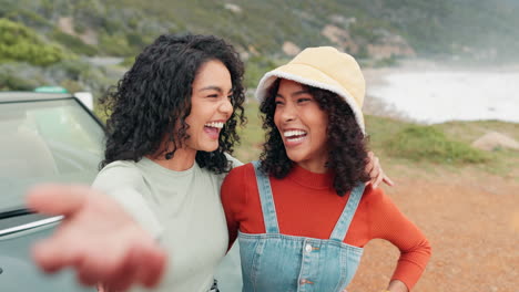 two women taking a selfie near a car