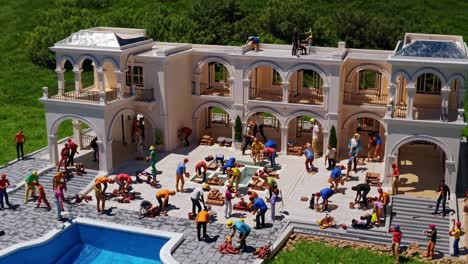 miniature construction workers are busy building a beautiful luxury villa with arches, balconies, a swimming pool and a rooftop terrace, creating a detailed and captivating scene