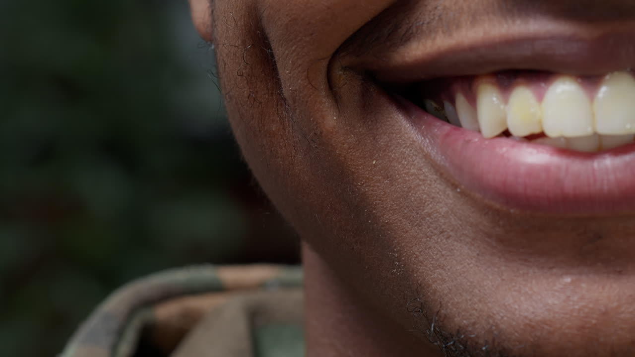 Macro shot of man showing half of face in front of camera