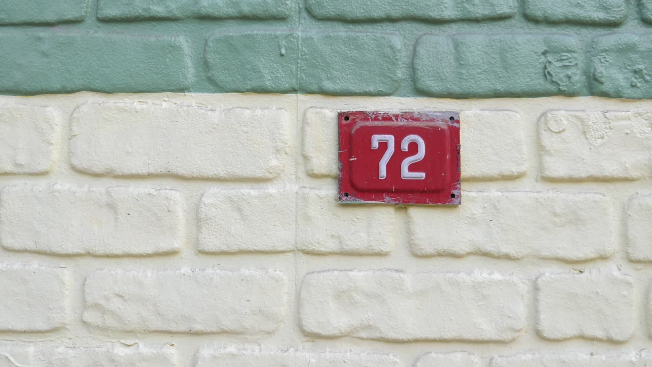 Number 72 on a Brick Wall