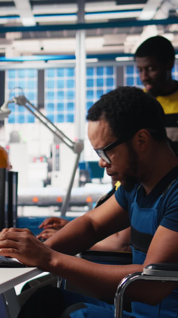 Vertical Video Black engineer with disability works on manufacturing solar panels