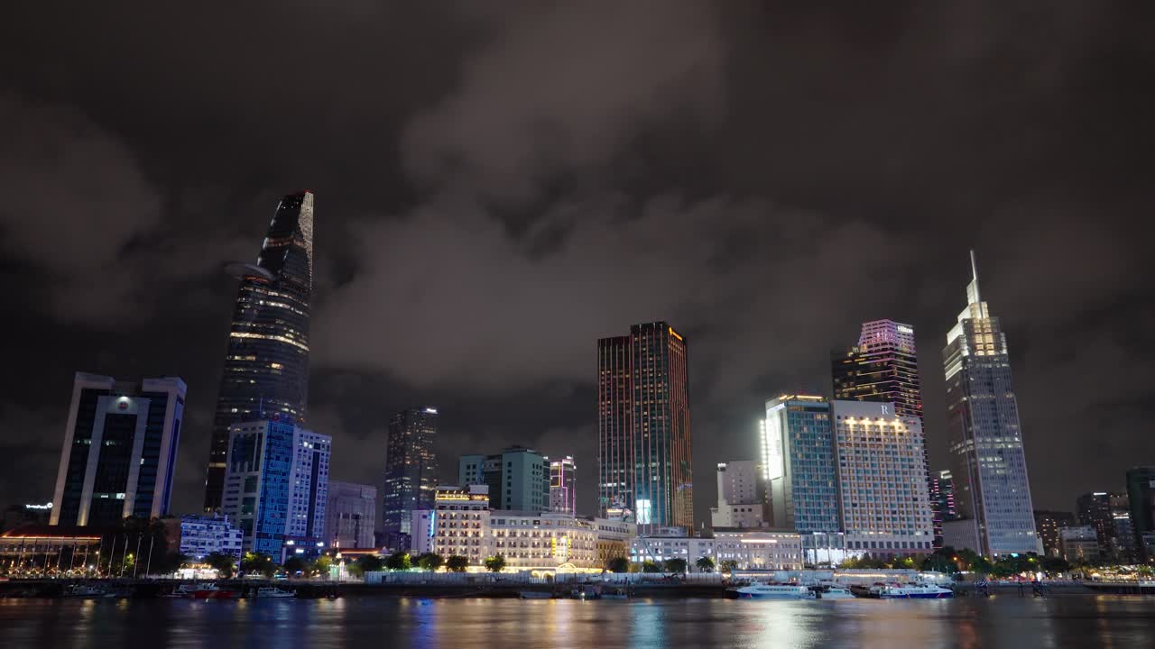 Night timelapse of the Ho Chi Minh City skyline, featuring Bitexco Tower and the Saigon River, Vietnam