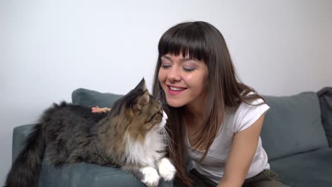 young woman caressing her cat