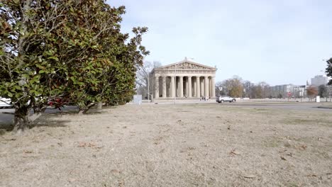 parthenon building in nashville, tennessee with drone video moving in at an angle low