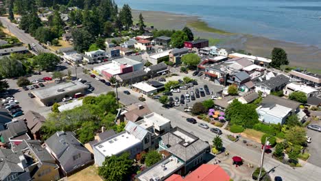 orbiting aerial view of the main street stores in langley, washington