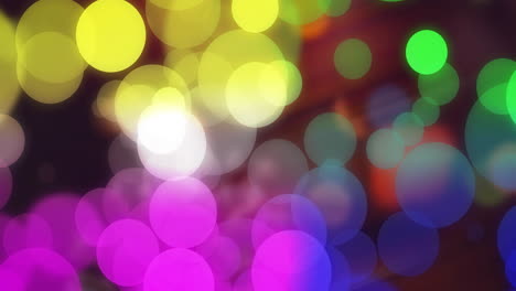 animation of colourful spots on black background