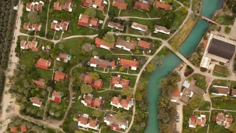 aerial view of a quaint village by a river