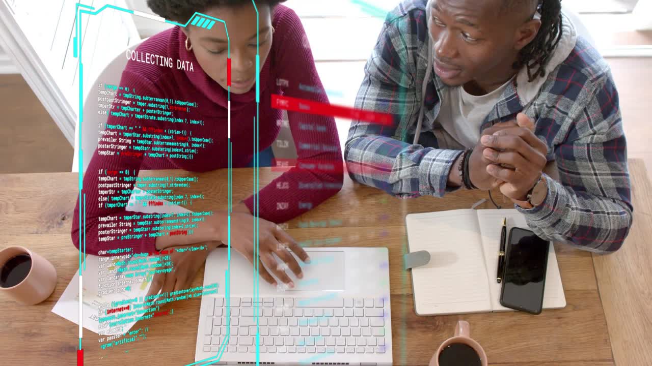 Two colleagues tapping pages and typing on laptop, initiating business review with holo overlay
