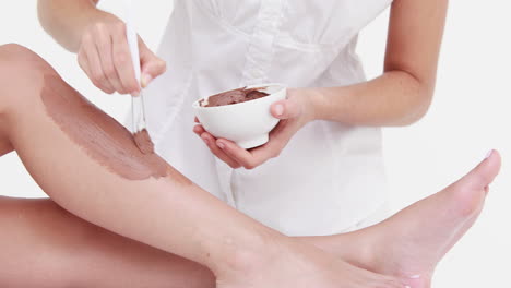 woman getting a beauty treatment on legs