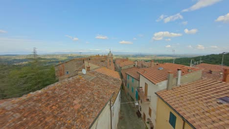 Above-a-typical-medieval-village-in-Tuscany,-Italy