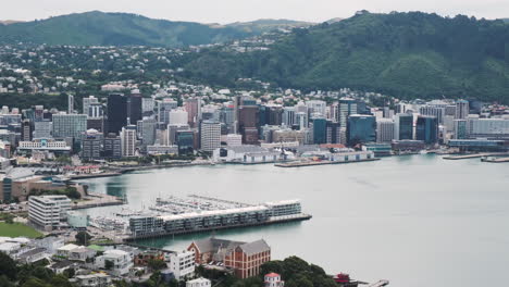 Slow-pan-of-Wellington's-waterfront,-showcasing-its-vibrant-cityscape-and-scenic-harbor