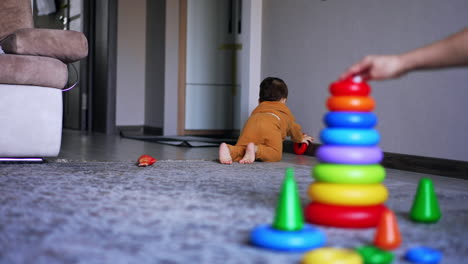 baby playing with toys in living room