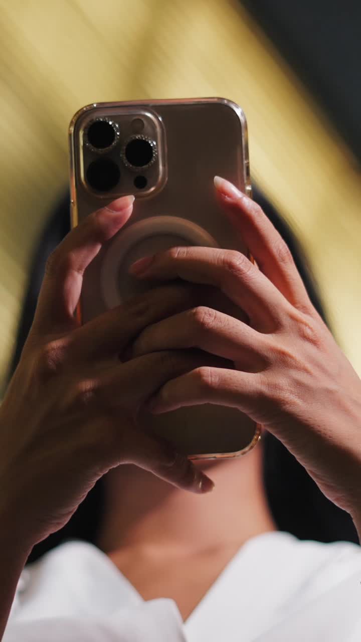 Woman taking a photo with her phone