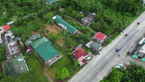 rising view of southeast asia home farm and agricultural field by road way