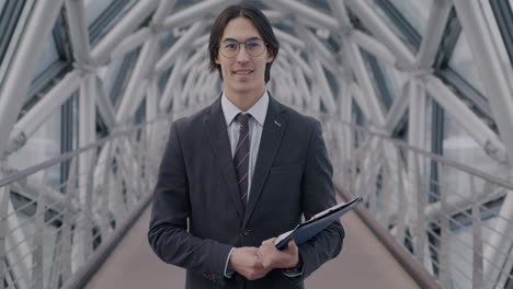 businessman walking on a modern bridge