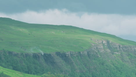 WIDE-SHOT---Scottish-waterfalls-being-blown-upwards-by-strong-winds,-west-coast