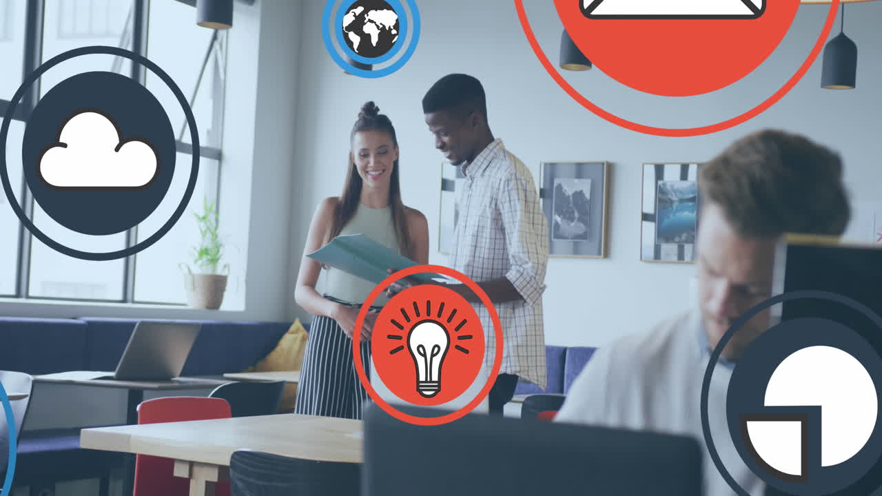 Animation of icon in circles over diverse coworkers standing and discussing reports in office
