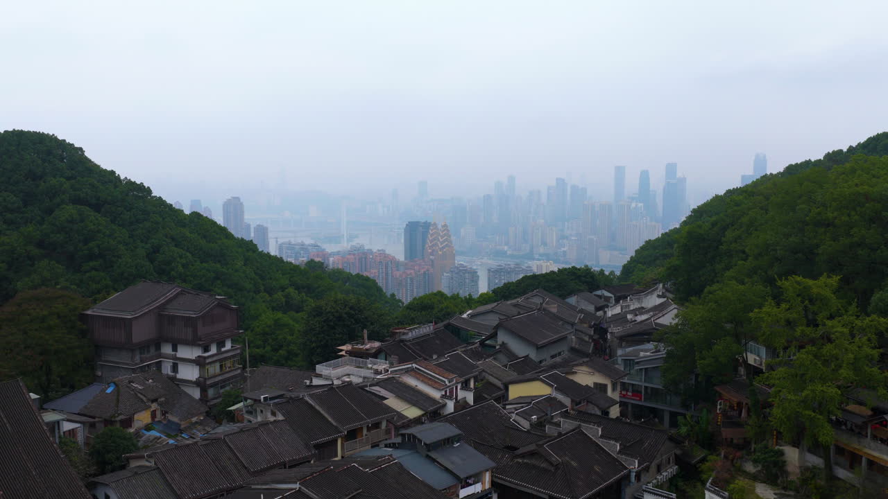 Huangjueya Old Street With The Modern Skyline Of Chongqing's Yuzhong District In The Background In China. Aerial Shot
