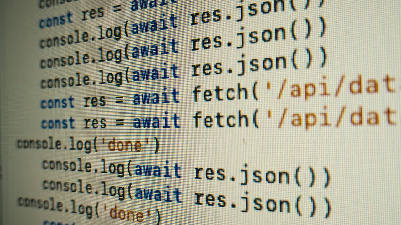 Close-Up of Programming Code Scrolling on a Computer Screen