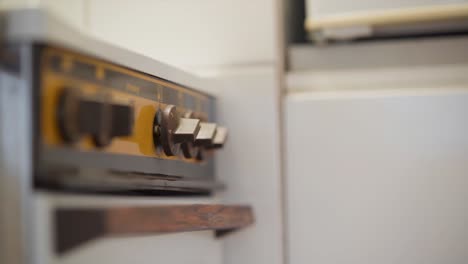 knobs on an electric stove being turned on and off