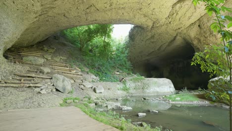 entrance of gods bridge, a popular tourist destination, a geological park and a speological site near vratsa